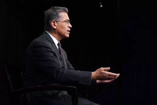 Health and Human Services Secretary Xavier Becerra, is interviewed by the Associated Press, Thursday, March 17, 2022, in Washington. (AP Photo/Jacquelyn Martin)