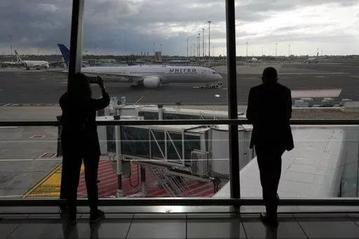People look at a United Airlines flight leaving for Newark, NJ, at Fiumicino's Leonardo Da Vinci airport, near Rome, Monday, Nov. 8, 2021.    Experience may be the best teacher when traveling. (AP Photo/Alessandra Tarantino, File)