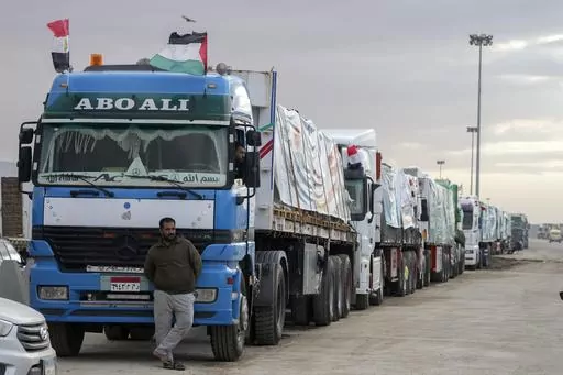 Trucks carrying humanitarian aid line up at the Rafah Border Crossing, Egypt, on the way to Gaza, Sunday, Nov. 19, 2023. A cumbersome process of Israeli inspections and other hurdles is slowing the entry of aid into Gaza, two U.S. senators say after a visit to Egypt's Rafah crossing into to besieged territory. Hundreds of trucks are lined up at Rafah, sometimes waiting weeks to go through the process. (AP Photo/Amr Nabil, File)