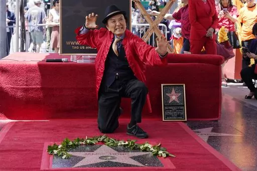 Actor James Hong poses after being honored with a star on the Hollywood Walk of Fame on May 10, 2022, in the Hollywood section of Los Angeles. has a starring role in the new “Gremlins” animated prequel, “Secrets of the Mogwai,” and pops up in “American Born Chinese” on Disney+. (AP Photo/Mark J. Terrill, File)