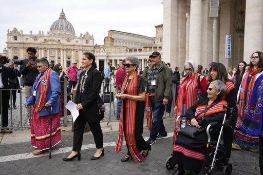 President of the Metis community, Cassidy Caron, second left, and other delegates arrive to speak to the media in St. Peter's Square after their meeting with Pope Francis at The Vatican, March 28, 2022. Pope Francis’ trip to Canada, which begins Sunday July 24, 2022, to apologize for the horrors of church-run Indigenous residential schools marks a radical rethink of the Catholic Church’s missionary legacy in the Americas, spurred on by the first American pope and the discovery of hundreds of