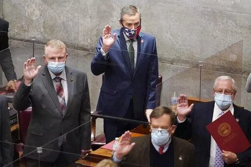 FILE-Rep. Glen Casada, R-Franklin, top center, is sworn in with other members on the first day of the legislative session Tuesday, Jan. 12, 2021, in Nashville, Tenn. (AP Photo/Mark Humphrey)