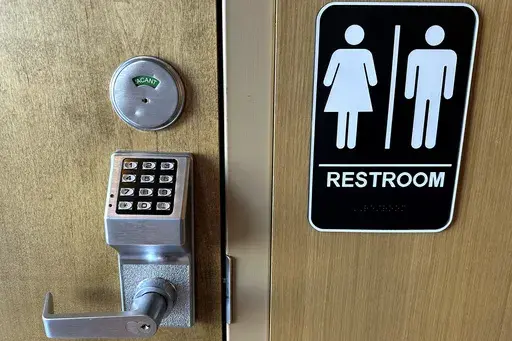 Passcode lock is seen at a restroom door in a Starbucks in Glenview, Ill., Thursday, Jan. 16, 2025. (AP Photo/Nam Y. Huh)
