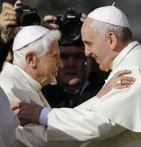 Pope Francis, right, hugs Pope Emeritus Benedict XVI prior to the start of a meeting with elderly faithful in St. Peter's Square at the Vatican, Sunday, Sept. 28, 2014. Pope Francis on Wednesday, Dec. 28, 2022, said his predecessor, Pope Emeritus Benedict XVI, is “very sick," and he asked the faithful to pray for the retired pontiff so God will comfort him “to the very end.” (AP Photo/Gregorio Borgia, File)