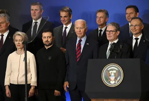 U.S. President Joe Biden, center, with Ukraine's President Volodymyr Zelenskyy, front second left, European Commission President Ursula von der Leyen, front left, Britain's Prime Minister Keir Starmer, front second right, Poland's President Andrzej Duda, right, and other world leaders pose at the launch of the Joint Declaration of Support for Ukrainian Recovery and Reconstruction, on Sept. 25, 2024, in New York. (Leon Neal/Pool Photo via AP, File)