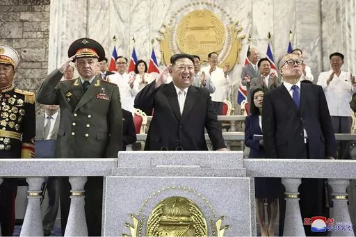 In this photo provided by the North Korean government, North Korean leader Kim Jong Un, center, Russian Defense Minister Sergei Shoigu, left, and China's Vice Chairman of the standing committee of the country’s National People’s Congress Li Hongzhong, right, attend a military parade to mark the 70th anniversary of the armistice that halted fighting in the 1950-53 Korean War, on Kim Il Sung Square in Pyongyang, North Korea Thursday, July 27, 2023. Independent journalists were not given access