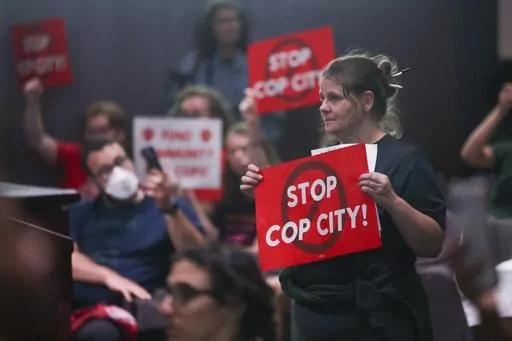 Protestors reacts before council members voted 11-4 to approve legislation to fund the Atlanta Public Safety Training Center, June 6, 2023, in Atlanta. Sixty-one people have been indicted in Georgia on racketeering charges following a long-running state investigation into protests against a proposed police and training facility in the Atlanta area that critics call “Cop City.” The Tuesday, Aug. 29, 2023, indictment under the state’s racketeering law was released by Fulton County officials 