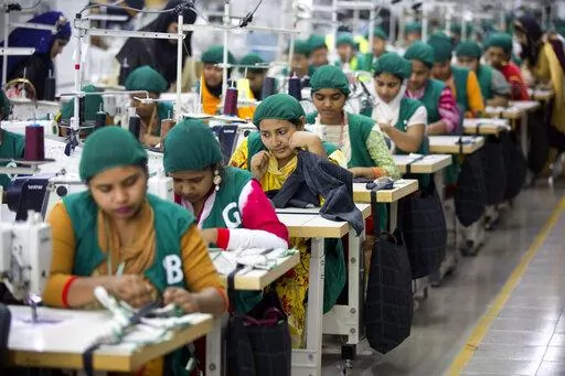 Trainees work at Snowtex garment factory in Dhamrai, near Dhaka, Bangladesh, April 19, 2018. Bangladesh's economic miracle is under severe strain as fuel price hikes amplify public frustrations over rising costs for food and other necessities. (AP Photo/A.M. Ahad, File)