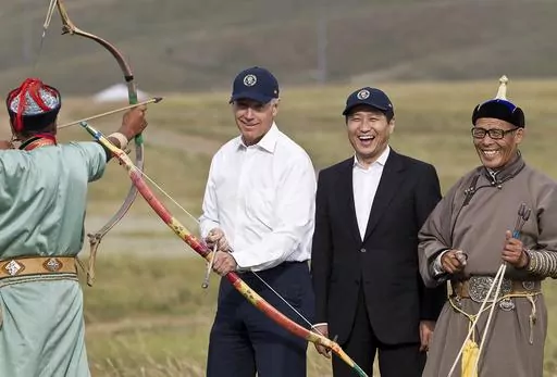 U.S. Vice President Joe Biden, center left, accompanied by Mongolian Prime Minister Sukhbaatar Batbold, center right, tries out archery during a tour in Ulan Bator, Mongolia, Aug. 22, 2011. The release of a transcript of Biden's interview with prosecutors investigating his handling of classified documents offers a rare window into the day-to-day life for the president. One question morphed into a well-worn tale of that one time he "embarrassed the hell" out of the leader of Mongolia. (AP Photo/A