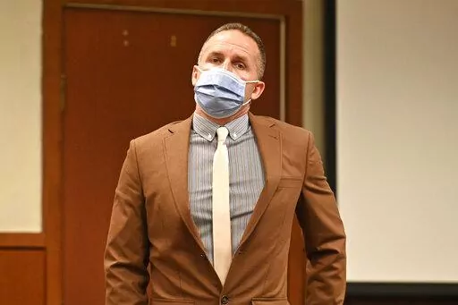 Former Louisville police officer Brett Hankison prepares to leave the courtroom during a recess, Wednesday, Feb. 23, 2022, during his trial in Louisville, Ky.   Prosecutors begin their case against Hankison, charged with wanton endangerment for shooting through Breonna Taylor's apartment into the home of her neighbors during botched police raid that killed Taylor.  (AP Photo/Timothy D. Easley, Pool)