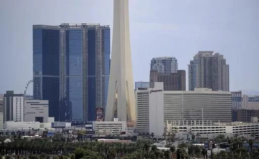 The partially completed Fontainebleau Las Vegas, the blue building on the left, stands along the skyline, Aug. 29, 2017, in Las Vegas. Fountainebleau Las Vegas announced Tuesday morning, May 2, 2023, that it plans to open its doors to the public in December 2023. The towering blue-glass resort — one of Las Vegas’ tallest building — has sat unfinished on the Strip for more than a decade. (AP Photo/John Locher, File)