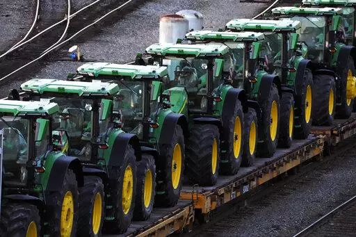 A consist of John Deere tractors sit in Norfolk Southern's Conway Yard in Conway, Pa., Monday, Dec. 5, 2022. On Thursday, the Labor Department releases the producer price index for January, an indicator of inflation at the wholesale level that's closely monitored by the Federal Reserve. (AP Photo/Gene J. Puskar, File)