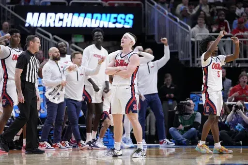 Mississippi guard Sean Pedulla, center, reacts after scoring a 3-point basket against North Carolina during the second half in the first round of the NCAA college basketball tournament Friday, March 21, 2025, in Milwaukee. (AP Photo/Kayla Wolf)