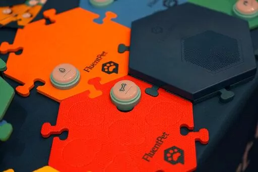 FluentPet dog communication buttons are on display during the Pepcom Digital Experience before the start of the CES tech show, Wednesday, Jan. 4, 2023, in Las Vegas. (AP Photo/John Locher)