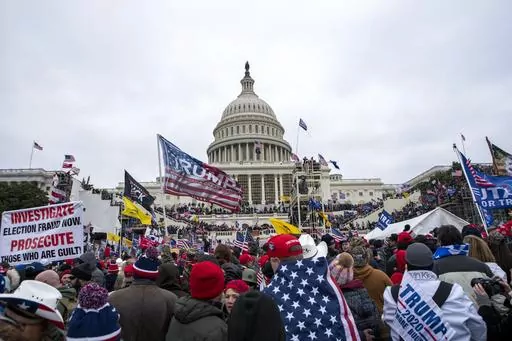 Insurrections loyal to President Donald Trump rally at the U.S. Capitol in Washington on Jan. 6, 2021. Ray Epps, an Arizona man who became the center of a conspiracy theory about Jan. 6, 2021, has been charged with a misdemeanor offense in connection with the U.S. Capitol riot, according to court papers filed Tuesday. Epps is charged with a single count of a disorderly or disruptive conduct on restricted grounds. (AP Photo/Jose Luis Magana, File)