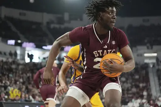 Mississippi State center Michael Nwoko cradles a rebound during the first half of an NCAA college basketball game against LSU, Saturday, March 1, 2025, in Starkville, Miss. (AP Photo/Rogelio V. Solis)