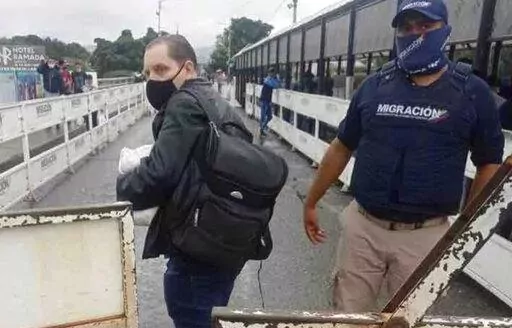 In this photo provided by the Kenemore family, Jerrel Kenemore stands at a Colombian checkpoint in the middle of the Simon Bolivar international bridge connecting San Antonio del Tachira, Venezuela with Villa del Rosario, Colombia, the second week of March 2022. Kenemore, from the Dallas area, is one of at least three American citizens who were quietly arrested in 2022 allegedly trying to enter Venezuela illegally and are being held at a maximum security prison facing long sentences, The Associa