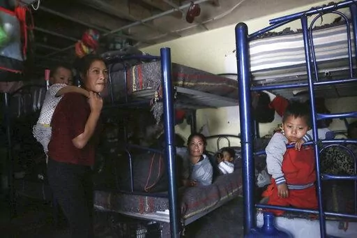 Migrants rest in a dormitory of the Good Samaritan shelter in Juarez, Mexico, on March 29, 2022. The number of migrants attempting to cross the U.S.-Mexico border has surged in recent weeks as the U.S. prepares for even larger numbers with the expected lifting of a pandemic-era order that turned away asylum seekers. (AP Photo/Christian Chavez, File)