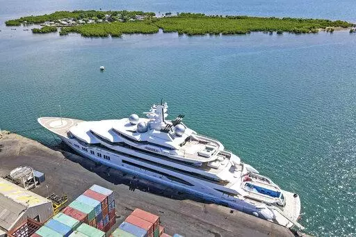 The superyacht Amadea is docked at the Queens Wharf in Lautoka, Fiji, on April 15 2022. A judge in Fiji is due to rule Monday, May 2, 2022, on whether U.S. authorities can seize the luxurious yacht — worth some $325 million — which has been stopped from leaving the South Pacific nation because of its links to Russia. (Leon Lord/Fiji Sun via AP)