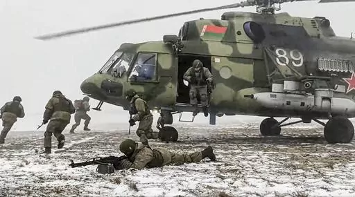 In this photo taken from video and released by the Russian Defense Ministry Press Service on Friday, Feb. 4, 2022, soldiers take part in joint drills between Belarus and Russia at Brestsky firing range in Belarus. Belarus President Alexander Lukashenko has welcomed thousands of Russian troops to his country, allowed the Kremlin to use it to launch the invasion of Ukraine on Feb. 24, 2022, and offered to station some of Moscow’s tactical nuclear weapons there. But he has avoided having Belarus 