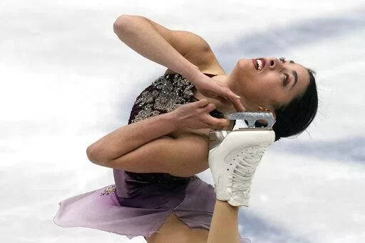 Madeline Schizas, of Canada, performs in the women short program at the Figure Skating World Championships in Montpellier, south of France, Wednesday, March 23, 2022. (AP Photo/Francisco Seco)