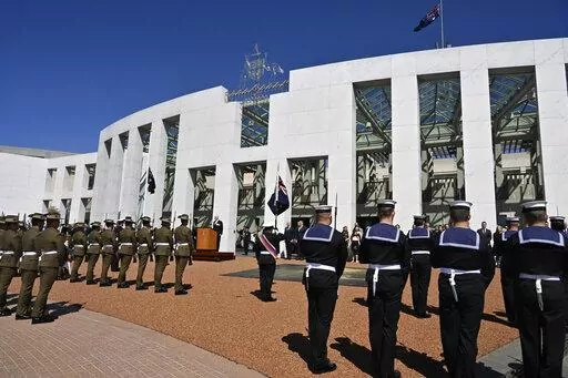 Australia's Governor-General David Hurley, center back, speaks at the proclamation of King Charles III, on the forecourt of Parliament House in Canberra, Sunday, Sept. 11, 2022. Australia's Prime Minister Anthony Albanese defended a protocol that bars the nation's parliament from sitting for 15 days following a British monarch's death. (Mick Tsikas/AAP Image via AP)