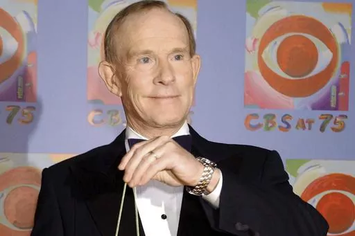 Tom Smothers does yo-yo tricks during arrivals at CBS's 75th anniversary celebration Sunday, Nov. 2, 2003, in New York. Tom Smothers, half of the Smother Brothers and the co-host of one of the most socially conscious and groundbreaking television shows in the history of the medium, has died, Tuesday, Dec. 26, 2023 at 86. (AP Photo/Louis Lanzano, File)
