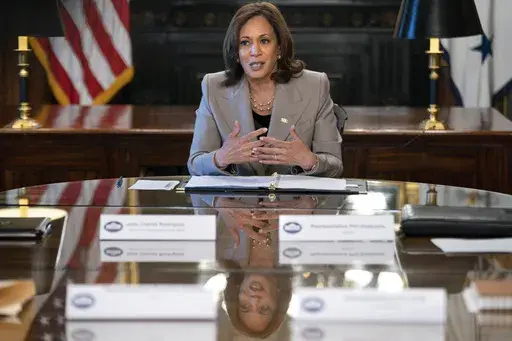 Vice President Kamala Harris is reflected in a table as she speaks while meeting with state legislators about protecting reproductive rights, Friday, July 8, 2022, in her ceremonial office inside the Eisenhower Executive Office Building on the White House complex in Washington. (AP Photo/Jacquelyn Martin, File)
