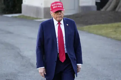 President Donald Trump walks before talking with reporters before boarding Marine One on the South Lawn of the White House in Washington, Friday, Feb. 28, 2025. (AP Photo/Ben Curtis)