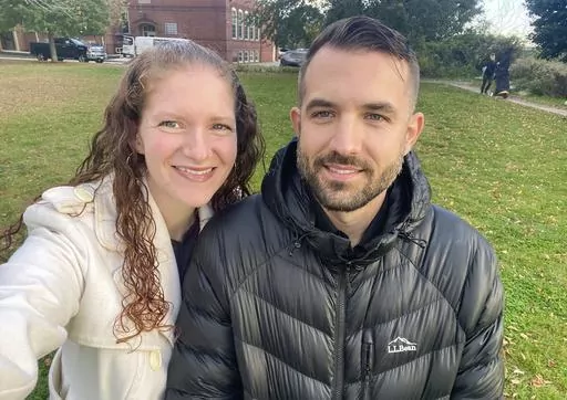 In this undated photo provided by Elizabeth Seal, American Sign Language interpreter Josh Seal poses with his wife, Elizabeth. Josh Seal was one of four deaf people killed in last week's mass shootings in Lewiston, Maine. (Elizabeth Seal via AP)