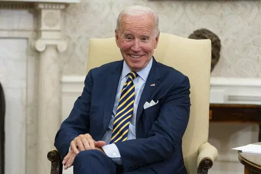 President Joe Biden smiles in the Oval Office of the White House, Sept. 16, 2022, in Washington. The White House is reaching out to local governments. It's hosting officials from North Carolina on Thursday to highlight funding opportunities and hear firsthand how coronavirus relief, infrastructure dollars and other policies are faring in communities. (AP Photo/Alex Brandon, File)