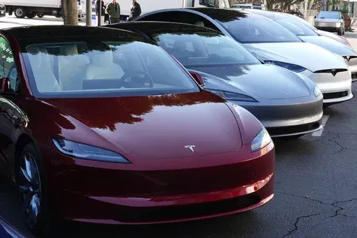 Tesla vehicles are displayed at the AutoMobility LA Auto Show,Thursday, Nov. 21, 2024, in Los Angeles. (AP Photo/Damian Dovarganes, File)