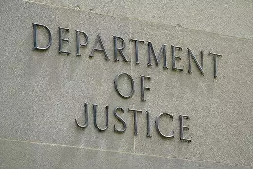 An exterior sign is photographed outside the Robert F. Kennedy Department of Justice building in Washington on May 4, 2021. President Joe Biden is nominating six lawyers to run U.S. attorney’s offices across the country, a diverse group of candidates in the latest picks for the top law enforcement positions. The nominees, being announced by the White House on Wednesday, Jan. 26, 2022, would run the federal prosecutors’ offices in Connecticut, Utah, Montana, Alaska, New Mexico and New Hampshi