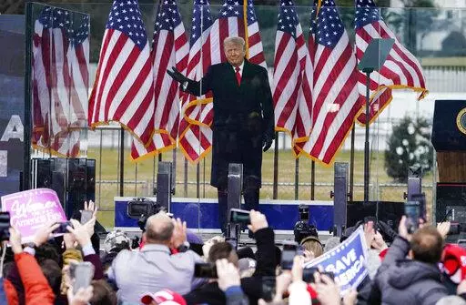 In this Jan. 6, 2021, photo, President Donald Trump arrives to speak at a rally in Washington. A federal judge on Feb. 18, 2022, rejected efforts by the former president to toss out lawsuits filed by lawmakers and two Capitol police officers, saying in his ruling that the former president's words "plausibly" may have led to the Jan. 6, 2021 insurrection. (AP Photo/Jacquelyn Martin, File)