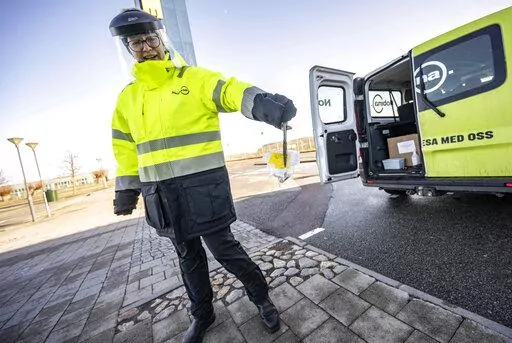 A member of staff collects the last COVID-19 PCR tests, at the Covid testing site of Svagertorp, Malmoe, Sweden, Tuesday, Feb. 8, 2022. Starting Wednesday, Sweden ends the wide-scale testing for COVID-19 even among people showing symptoms of coronavirus infection, a move that puts the Scandinavian nation at odds with most of Europe but could become the norm as the costs of testing yields fewer benefits as the omicron variant proves milder and governments begin to consider treating covid-19 as ot