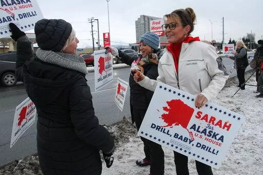 Former Alaska Gov. Sarah Palin, a Republican candidate for Alaska's sole seat in the U.S. House, meets with supporters waving her signs on Nov. 8, 2022, on a street corner in Anchorage, Alaska. Palin re-emerged in Alaska politics over a decade after resigning as governor with hopes of winning the state's U.S. House seat. But she struggled to catch fire with voters and ran what critics saw as a lackluster campaign against a breakout Democrat who pitched herself as a regular Alaskan and a Republic
