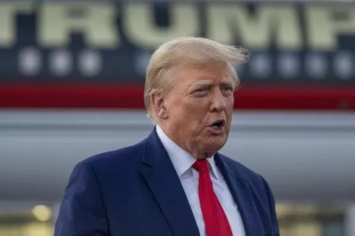 Former President Donald Trump speaks with reporters before departure from Hartsfield-Jackson Atlanta International Airport, Thursday, Aug. 24, 2023, in Atlanta. (AP Photo/Alex Brandon, File)