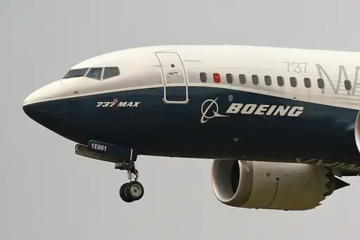 A Boeing 737 Max jet, piloted by Federal Aviation Administration (FAA) chief Steve Dickson, prepares to land at Boeing Field following a test flight on Sept. 30, 2020 in Seattle. On Sunday, July 7, 2024, the Justice Department said Boeing has agreed to plead guilty to a criminal fraud charge stemming from two deadly crashes of 737 Max jetliners. (AP Photo/Elaine Thompson, File)