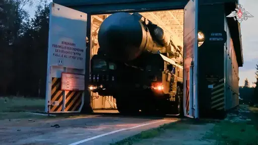 In this photo released by Russian Defense Ministry Press Service on Monday, July 22, 2024, a Yars intercontinental ballistic missile launcher rolls from an hangar during a military exercise near Yoshkar-Ola, Russia. Hawks in Russia have called for revising the country's nuclear doctrine to lower the threshold for using nuclear weapons, and President Vladimir Putin said the doctrine could be modified. (Russian Defense Ministry Press Service via AP)