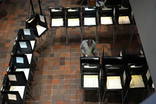 A person votes on the first day of early voting in the general election, Oct. 21, 2024, in Miami. (AP Photo/Lynne Sladky, File)