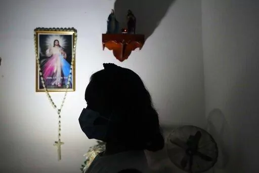 Hasini Wasana, a renal transplant patient, sits in her home in Negombo, outskirts of Colombo, Sri Lanka, June 19, 2022. Wasana had been diagnosed with a kidney ailment as a toddler and underwent a transplant nine months ago. She has to take a tablet for lifetime, an immunosuppressant to stop her body from rejecting the transplanted kidney. The government has no dollars to import them  and Wasana's family is dependent on donors because is too expensive in the private sector. Sri Lanka is bankrupt