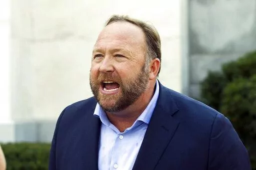 Infowars host and conspiracy theorist Alex Jones speaks outside of the Dirksen building on Capitol Hill in Washington, Sept. 5, 2018. Jury selection is set for Monday, July 25, 2022, in a trial that will determine for the first time how much Jones must pay Sandy Hook Elementary School parents for falsely telling his audience that the deadliest classroom shooting in U.S. history was a hoax. (AP Photo/Jose Luis Magana, File)