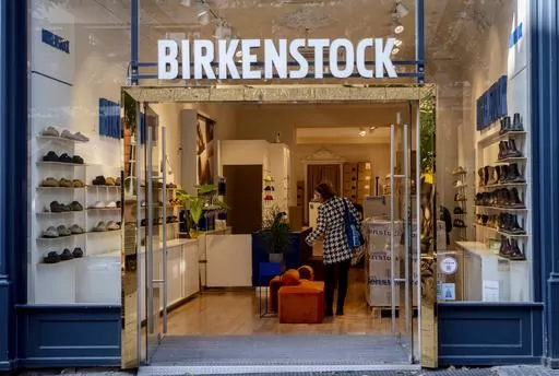 Signange marks the entrance to a Birkenstock store, Oct. 4, 2023, in Frankfurt, Germany. Birkenstock said Tuesday, Oct. 10, that it had priced its IPO at $46 a share, in the middle of its expected price range of $44 to $49 per share. It is due to start trading Wednesday, Oct. 11, on the New York Stock Exchange under the “BIRK” ticker symbol. (AP Photo/Michael Probst, File)