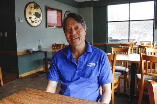 Charles Yee sits in his restaurant, Emperor's Kitchen, in Brookfield, Wis, on Feb. 23, 2022. He says while the Russian invasion of Ukraine is on his mind his priorities lie in his daily battle with the supply-chain problems, inflation and staffing shortages that continue to cling to the economy. Yee's view echoes in this western Milwaukee suburb, a politically dynamic swath of one of the nation's most evenly divided states. (AP Photo/Carrie Antlfinger)