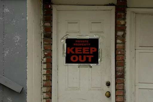 A keep out sign is posted on a home, Wednesday, April 19, 2023, near the house where 84-year-old Andrew Lester shot 16-year-old Ralph Yarl a week earlier in Kansas City, Mo. (AP Photo/Charlie Riedel, File)