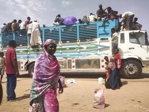 People board a truck as they leave Khartoum, Sudan, on June 19, 2023. Sudan has been torn by war for a year now, torn by fighting between the military and the notorious paramilitary Rapid Support Forces. (AP Photo, File)