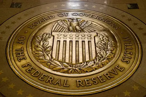 The seal of the Board of Governors of the United States Federal Reserve System is displayed in the ground at the Marriner S. Eccles Federal Reserve Board Building in Washington, Feb. 5, 2018. (AP Photo/Andrew Harnik, File)