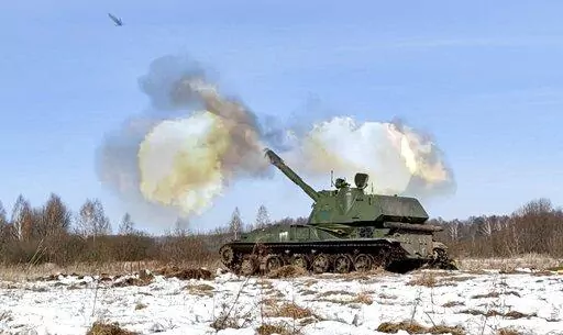 In this photo taken from video provided by the Russian Defense Ministry Press Service on Tuesday, Feb. 15, 2022, a self-propelled artillery mount fires at the Osipovichi training ground during the Union Courage-2022 Russia-Belarus military drills in Belarus. The Russian invasion of Ukraine is the largest conflict that Europe has seen since World War II, with Russia conducting a multi-pronged offensive across the country. The Russian military has pummeled wide areas in Ukraine with air strikes an