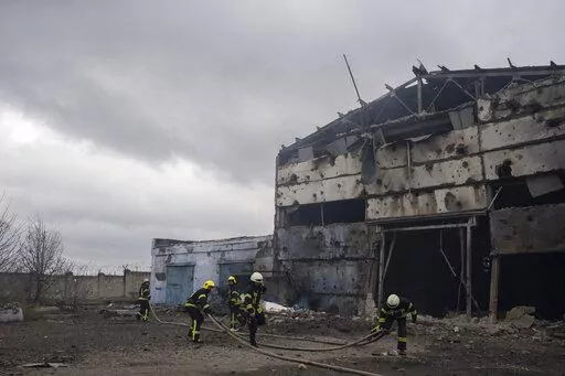 Firefighters try to extinguish the fire at a damaged factory following a Russian bombing in Kramatorsk, Ukraine, Thursday, April 14, 2022. (AP Photo/Petros Giannakouris)