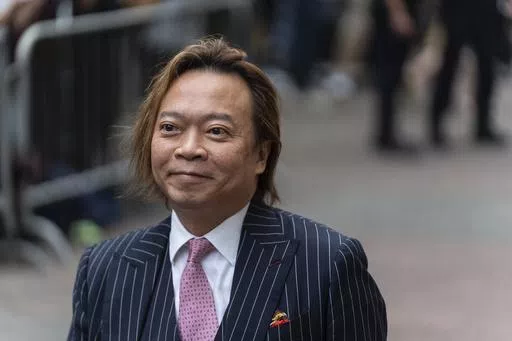 Lawrence Lau, a former pro-democracy district councilor, arrives at the West Kowloon Magistrates' Courts in Hong Kong, Thursday, May 30, 2024. (AP Photo/Chan Long Hei)